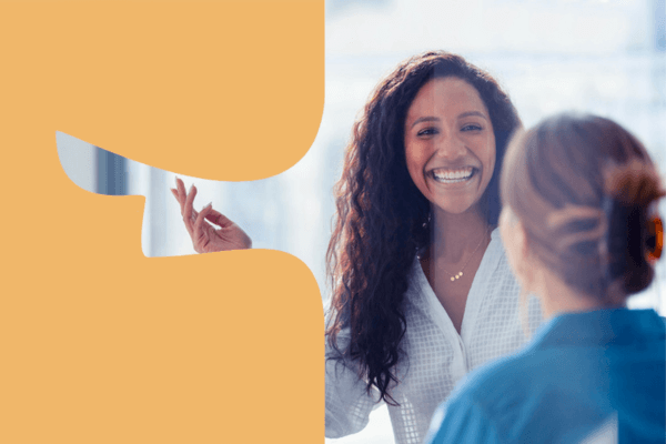 Two female work colleagues chatting