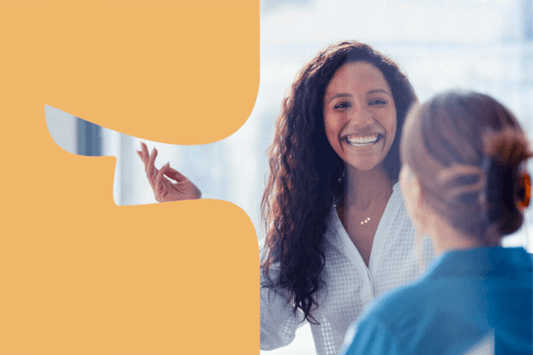Two female work colleagues chatting