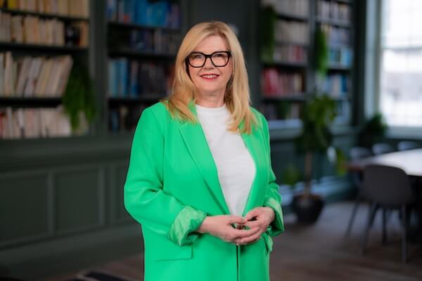 Doqit Founder Ctherine in bright green jacket