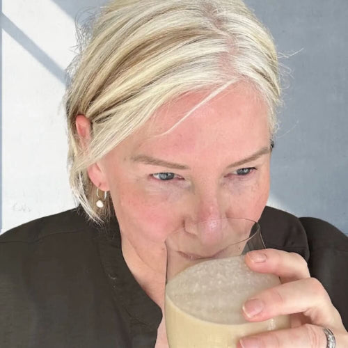 Angela drinking an Eve Biology vanilla shake