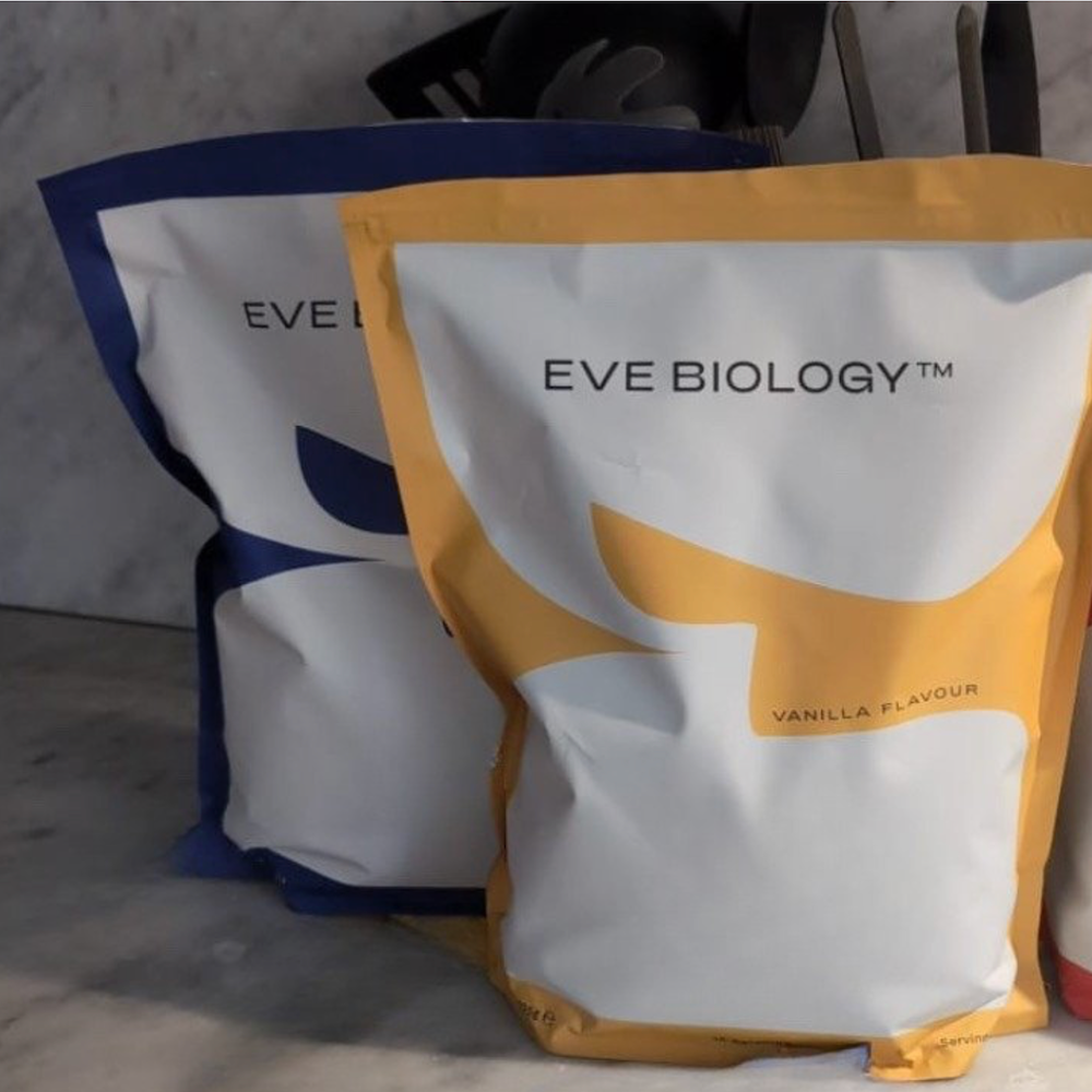 Two packages of Eve Biology product on a neutral background