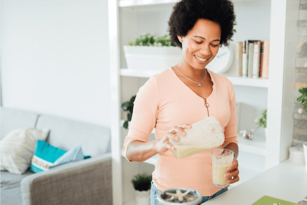 Woman mixing a shake