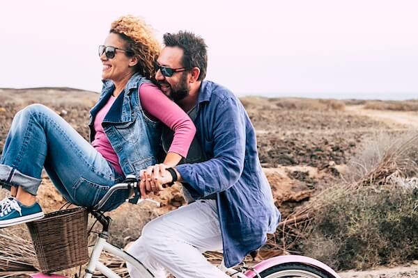 Middle aged couple on a bike