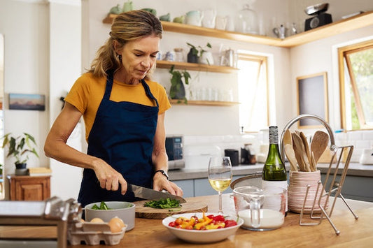 Woman in midlife cooking in a bright kitchen