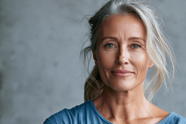 Woman in a blue t-shirt, grey hair