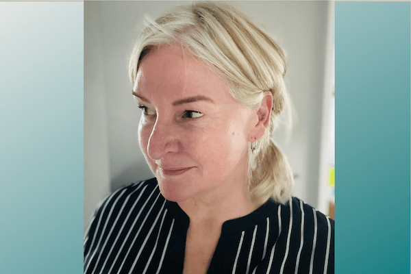 Blond woman in a blue striped blouse