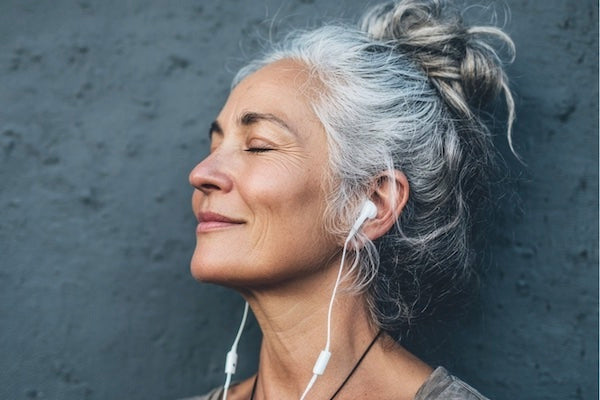 Woman relaxing listening to music