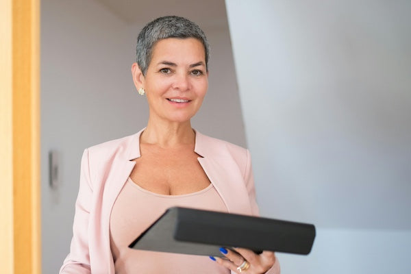 Attractive female director with laptop