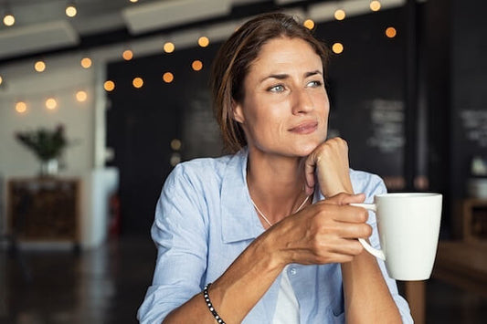 Woman in forties drinking shake