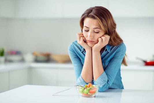 Woman over 40 with small salad