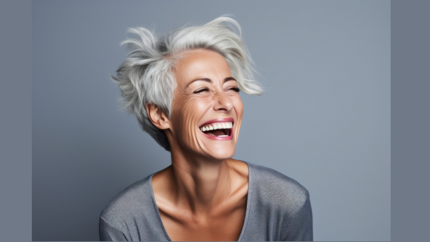 Grey haired woman laughing