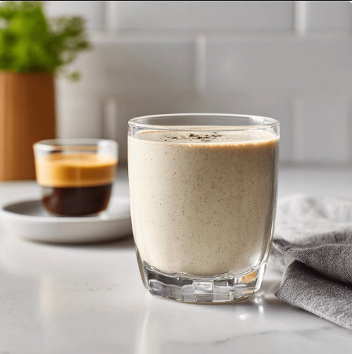 Vanilla meal replacement shake besides an espresso on kitchen counter