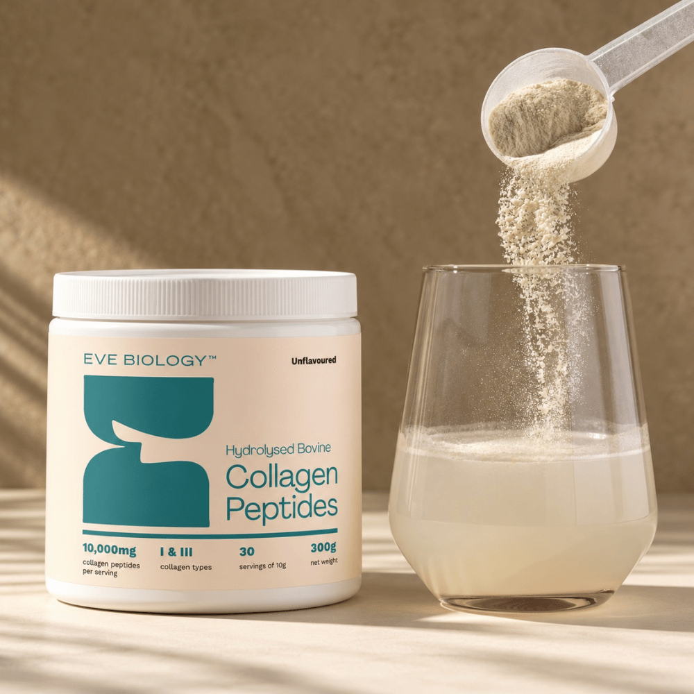 A white tub of EVE BIOLOGY Collagen Peptides sits on a warm beige surface next to a clear glass being filled with a pale beige powder poured from a white scoop.