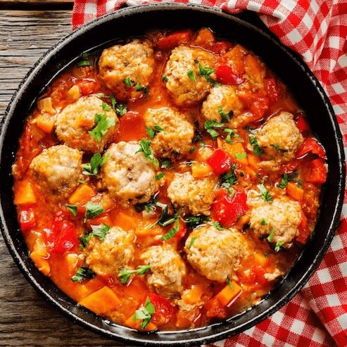 high protein Turney meatballs in a pan with tomato sauce