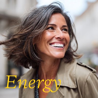 woman in a brown mac with brunette hair