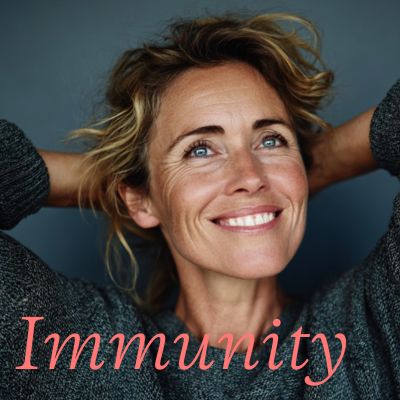 Healthy, vibrant , middle aged woman in a grey sweater