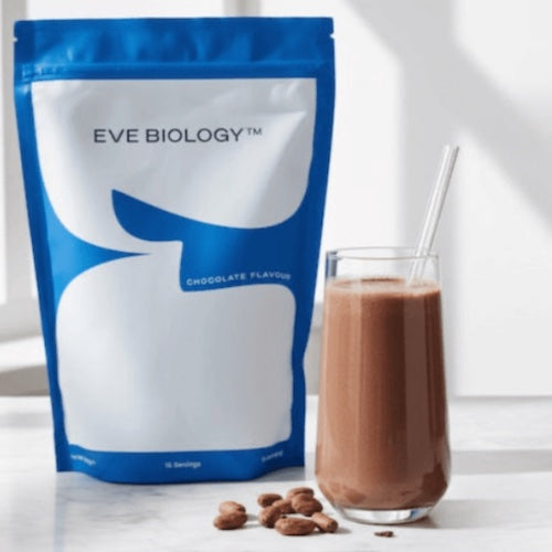 Eve Biology chocolate-flavored powder package with a glass of chocolate shake on a white surface.