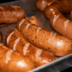 Close-up of sausages on a metal tray