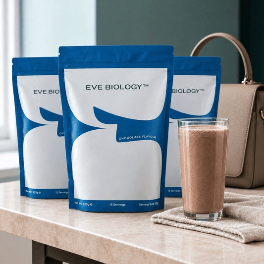 three blue pouches of Eve Biology shake on a marble counter with a woman's handbag in the background