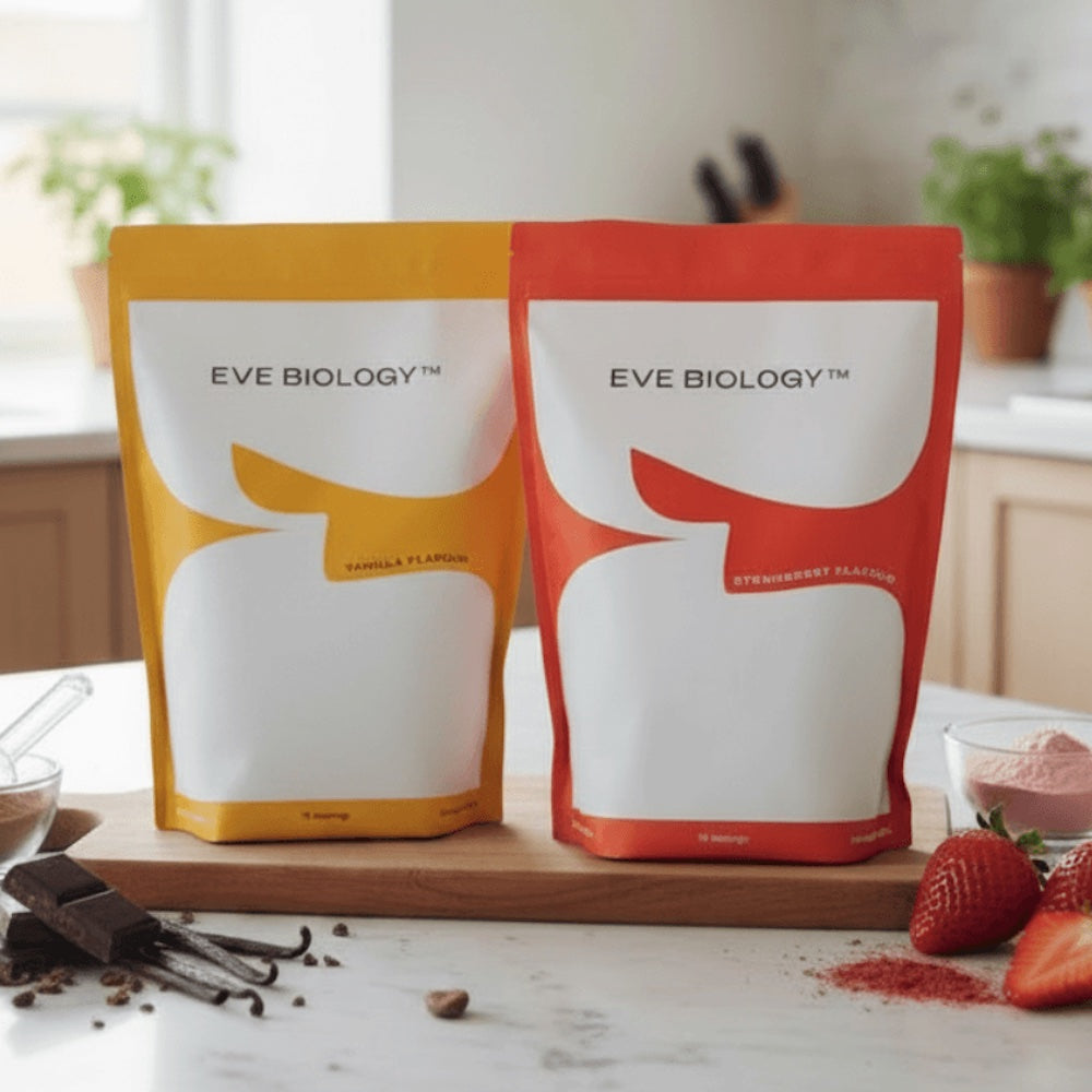 Two pouches of Eve Biology powder in yellow and orange sitting on a kitchen counter