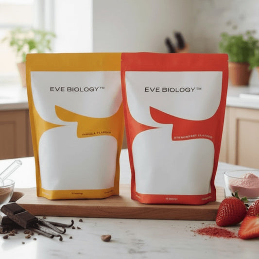 Two pouches of Eve Biology powder in yellow and orange sitting on a kitchen counter