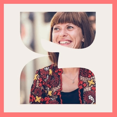 woman in a patterned blouse