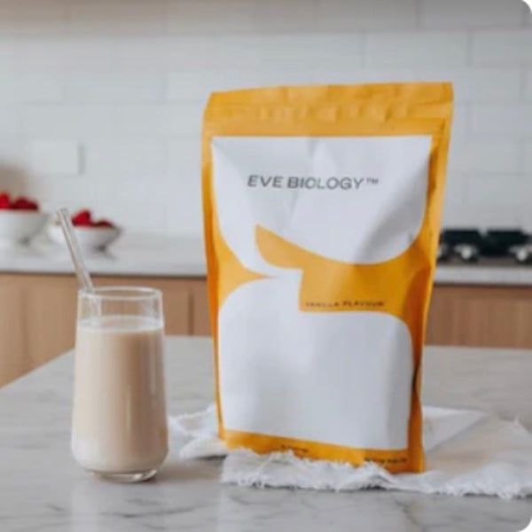Eve Biology package with a glass of milk on a kitchen counter