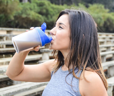 Woman drinking a meal replacement shake